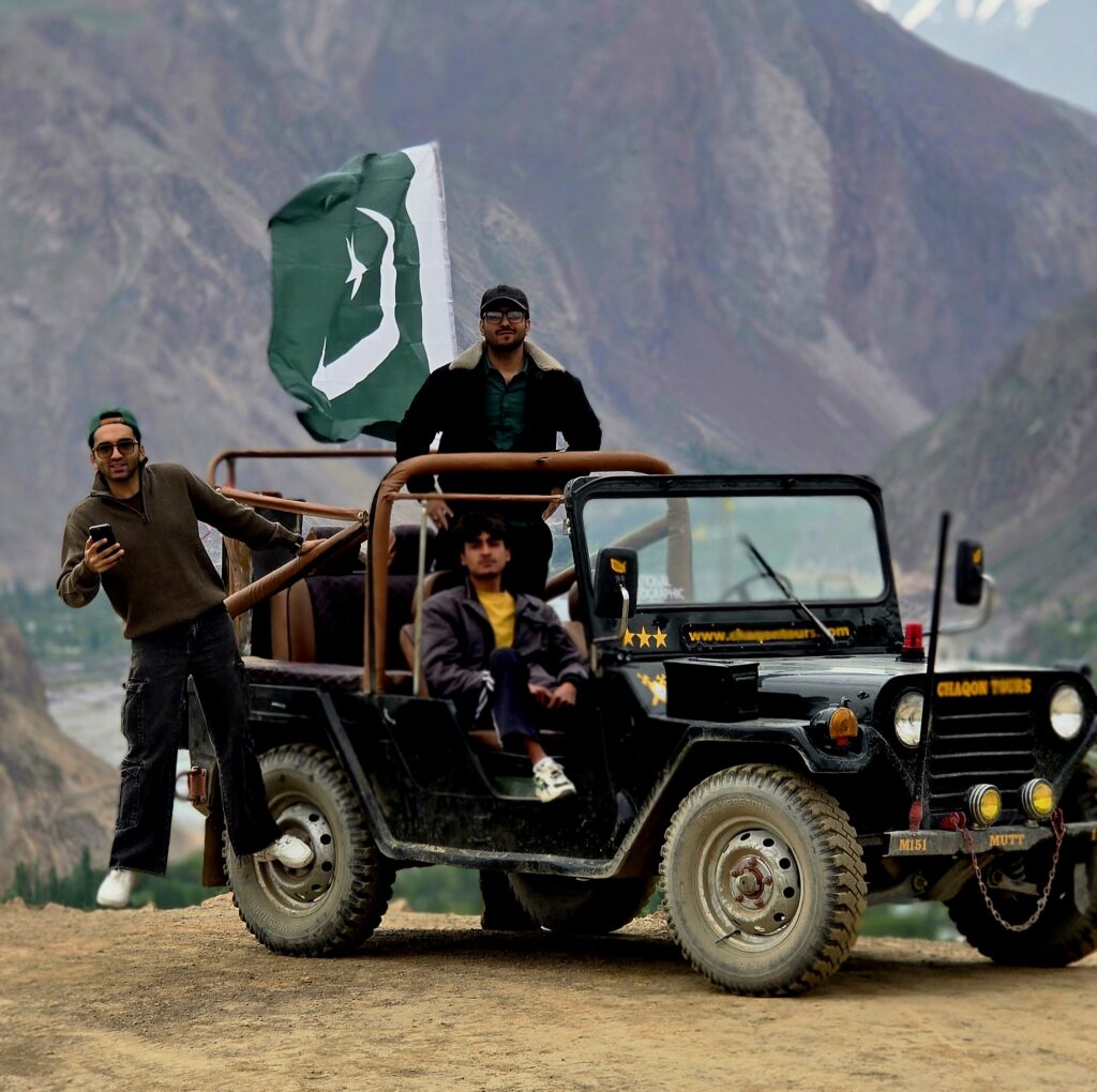 Chaqon Tours jeep with Pakistan flag in Hindukush